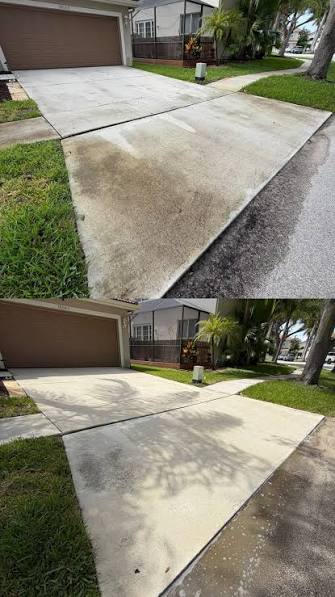 Clean sidewalk and driveway after a Palm Beach pressure cleaning visit