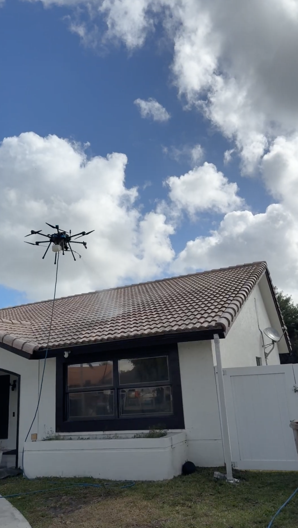 Soft wash roof cleaning on a Miami Beach coastal home