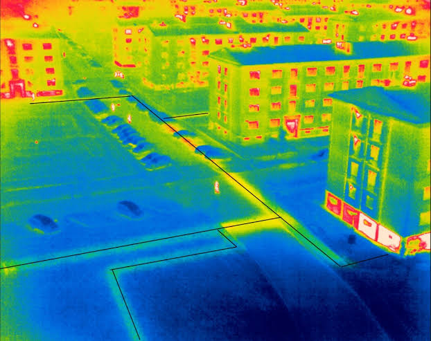 Infrared view across building rooftops and a courtyard